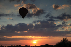 Sunset hot air balloon flight, over Fenland field