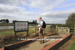 Walker on the Sir Peter Scott footpath, Sutton Bridge