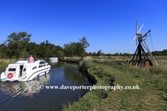 Boat on the river Ant passing How Hill Windpump