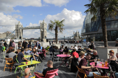 People on sun Loungers, South Bank river Thames