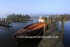 Misty dawn view over boats, Derwentwater, Keswick