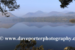 Misty dawn light over Derwentwater lake