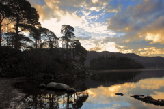 Sunrise over Friars Crag reflected in Derwentwater