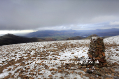 Winter, the summit cairn of Sail Fell