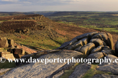 Summer evening light over Curbar gritstone edge