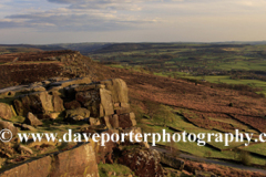 Summer evening light over Curbar gritstone edge