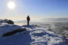 Winter walker on Curbar Edge