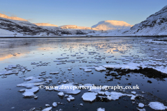 Sunset over frozen Hvalfjördur Fjord, West coast