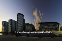 Sunset over the Media City Footbridge, Salford Quays, Manchester, Lancashire, England, UK