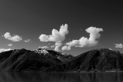 Reflections of mountains in Hardangerfjord Fjord