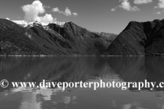 Reflections of mountains in Hardangerfjord Fjord