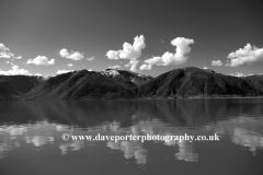 Reflections of mountains in Sognefjorden Fjord