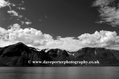 Reflections of mountains in Aurlandsfjorden Fjord