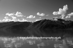 Reflections of mountains in Hardangerfjord Fjord