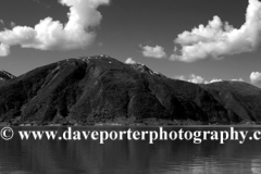 Reflections of mountains in Sognefjorden Fjord