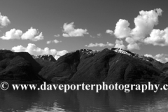 Reflections of mountains in Hardangerfjord Fjord