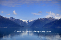 Reflections of mountains in Hardangerfjord Fjord