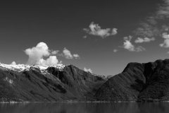 Reflections of mountains in Hardangerfjord Fjord