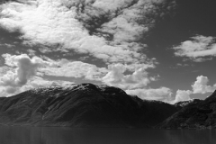 Reflections of mountains in Hardangerfjord Fjord