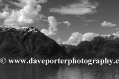 Reflections of mountains in Hardangerfjord Fjord