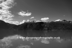 Reflections of mountains in Hardangerfjord Fjord