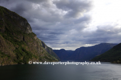 Reflections of mountains in Aurlandsfjorden Fjord