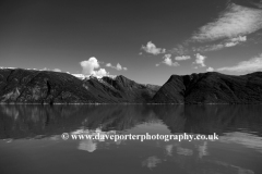 Reflections of mountains in Hardangerfjord Fjord