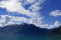 Reflections of mountains in Hardangerfjord Fjord