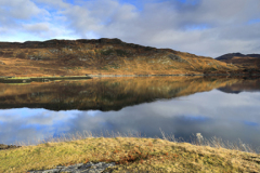 Reflections in Loch Gleann Dubh, Kylesku village